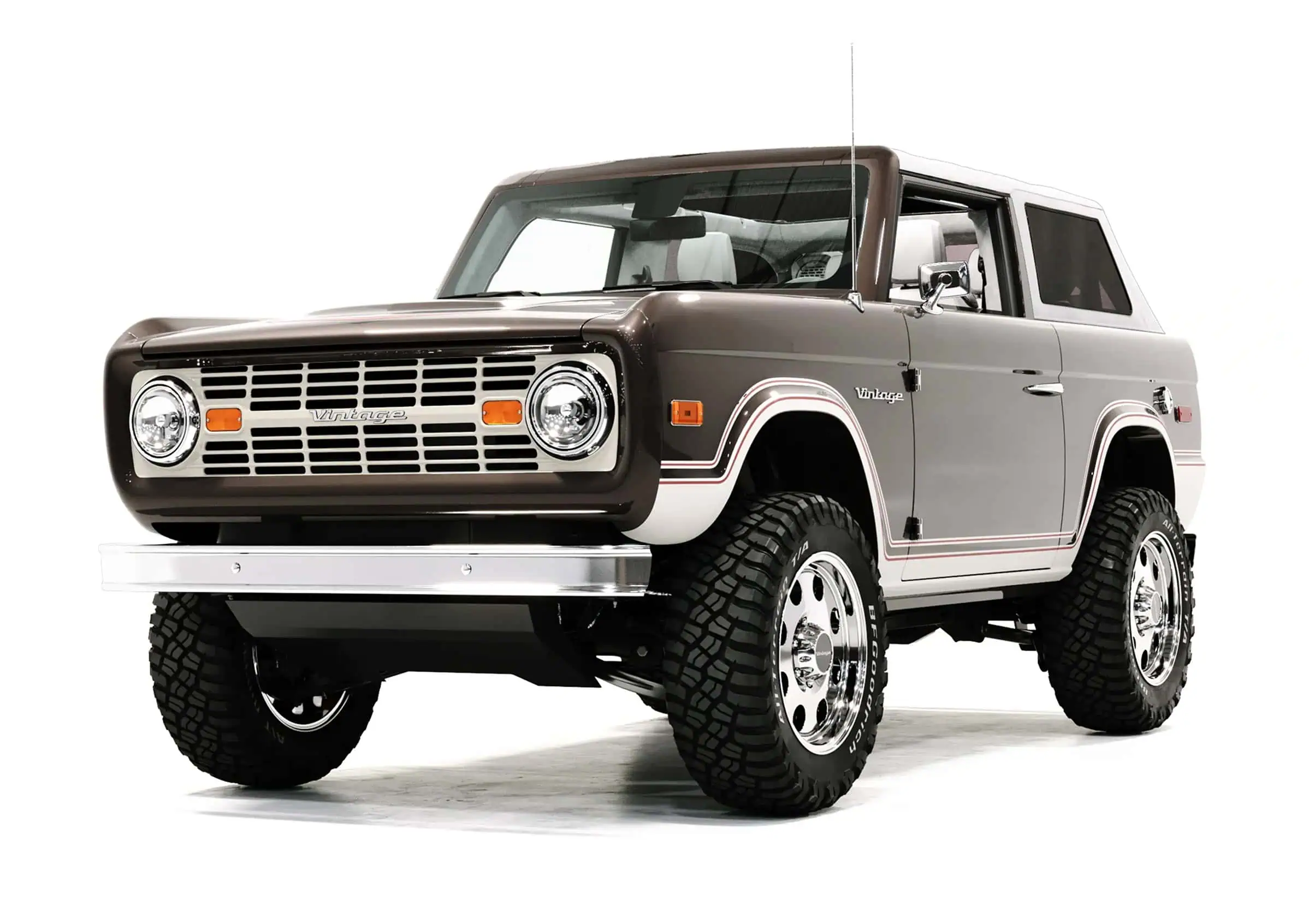 Vintage off-road SUV in classic brown and white with retro styling, large tires, and vintage modern design elements, showcasing rugged appeal and timeless automotive aesthetics.