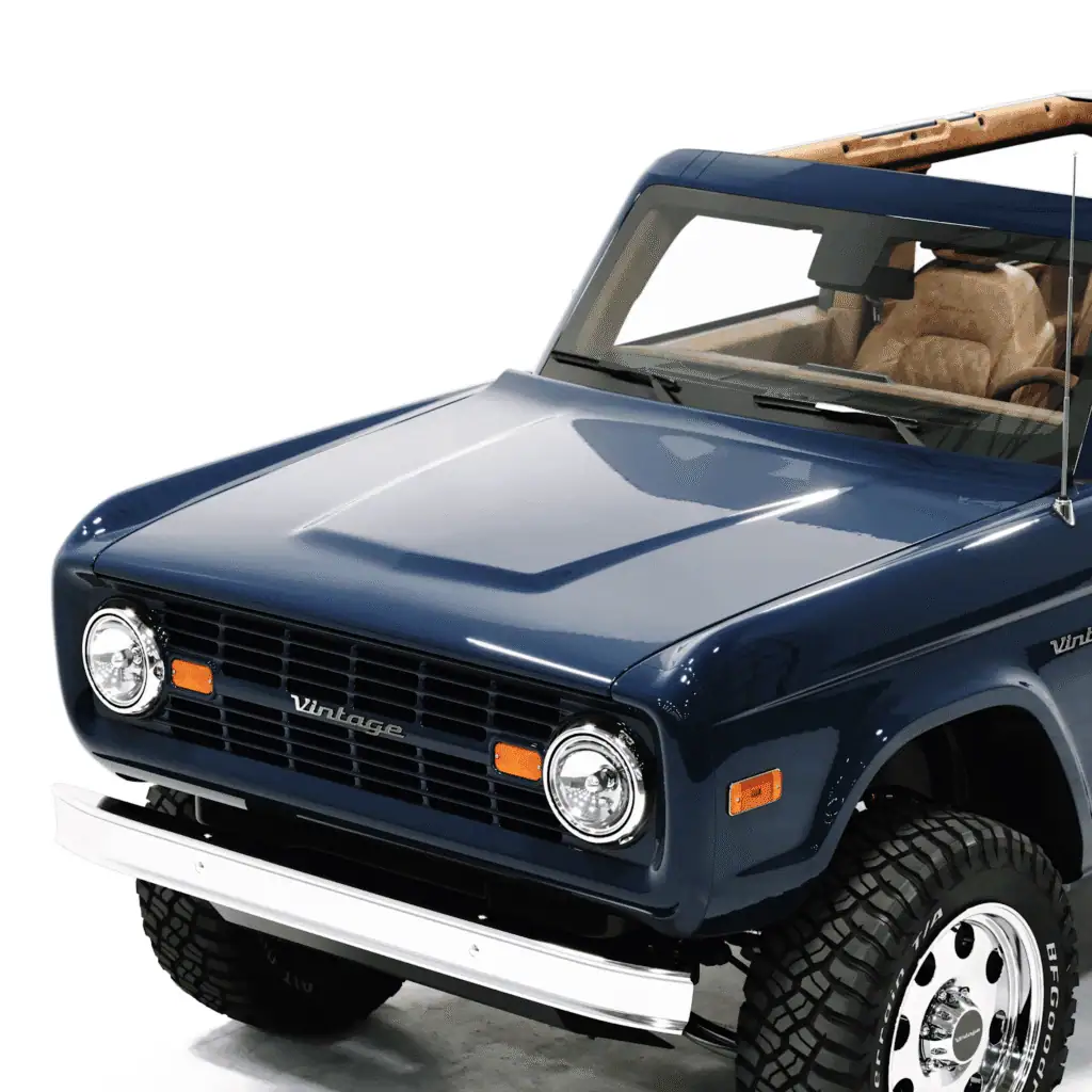 Vintage modern classic blue off-road vehicle with retro design and tan leather interior, showcasing timeless style and rugged appeal.