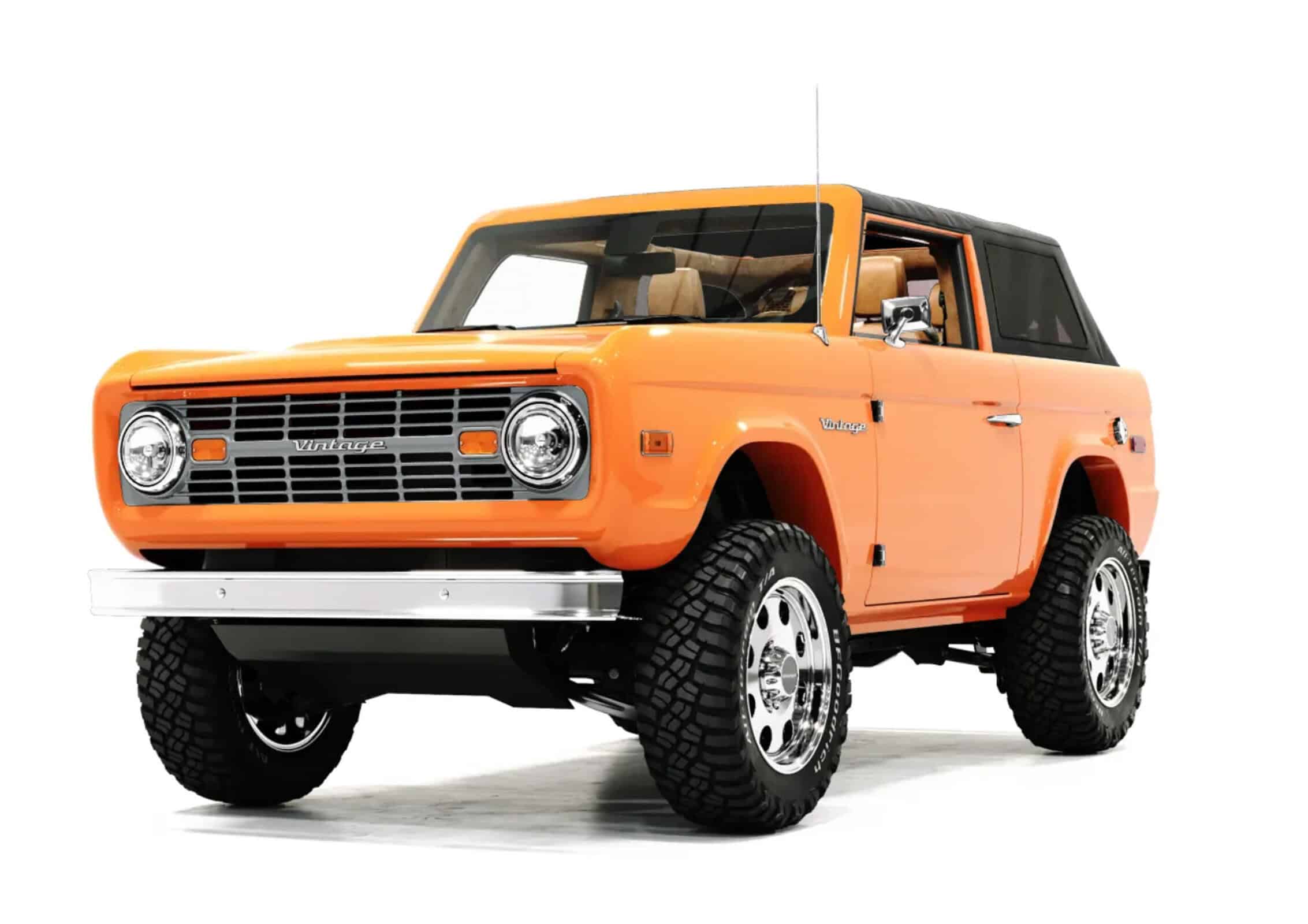 Vintage orange off-road SUV with retro styling and rugged tires, showcasing a blend of classic design and modern durability from Vintage Modern.