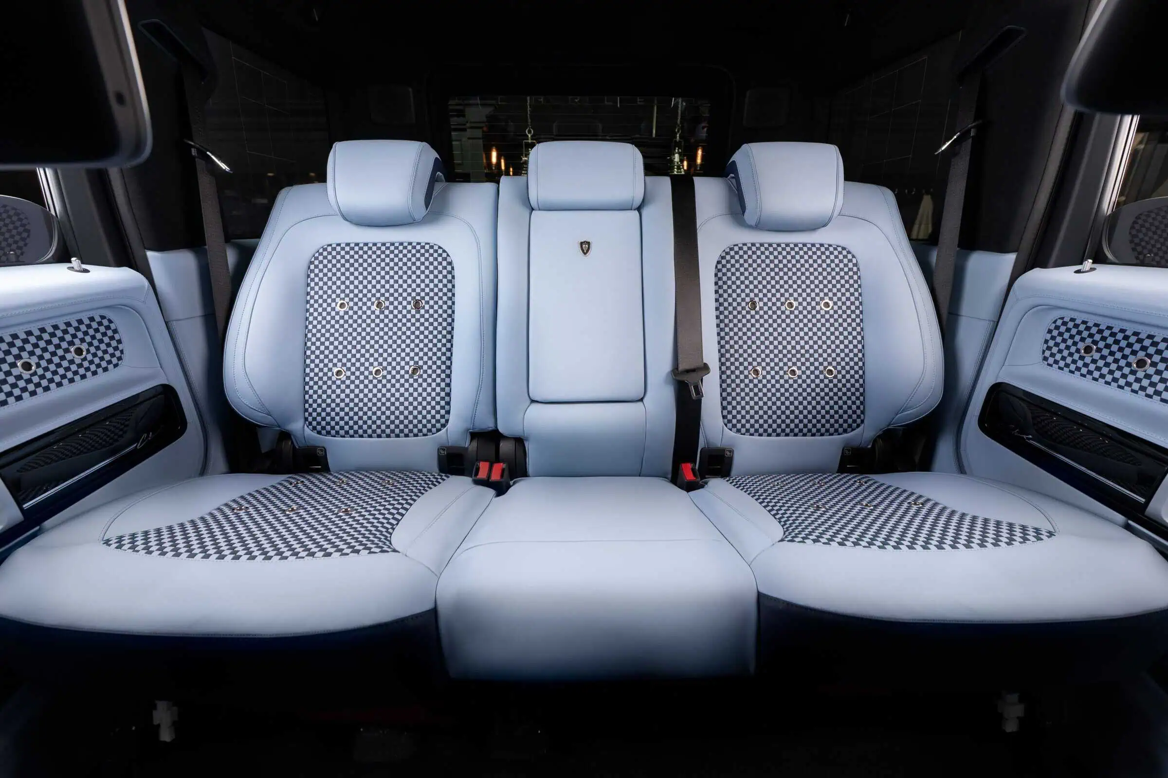Luxurious light blue vehicle seat upholstery with checkered pattern accents, modern design, and premium comfort, perfect for stylish car customization and interior enhancements.