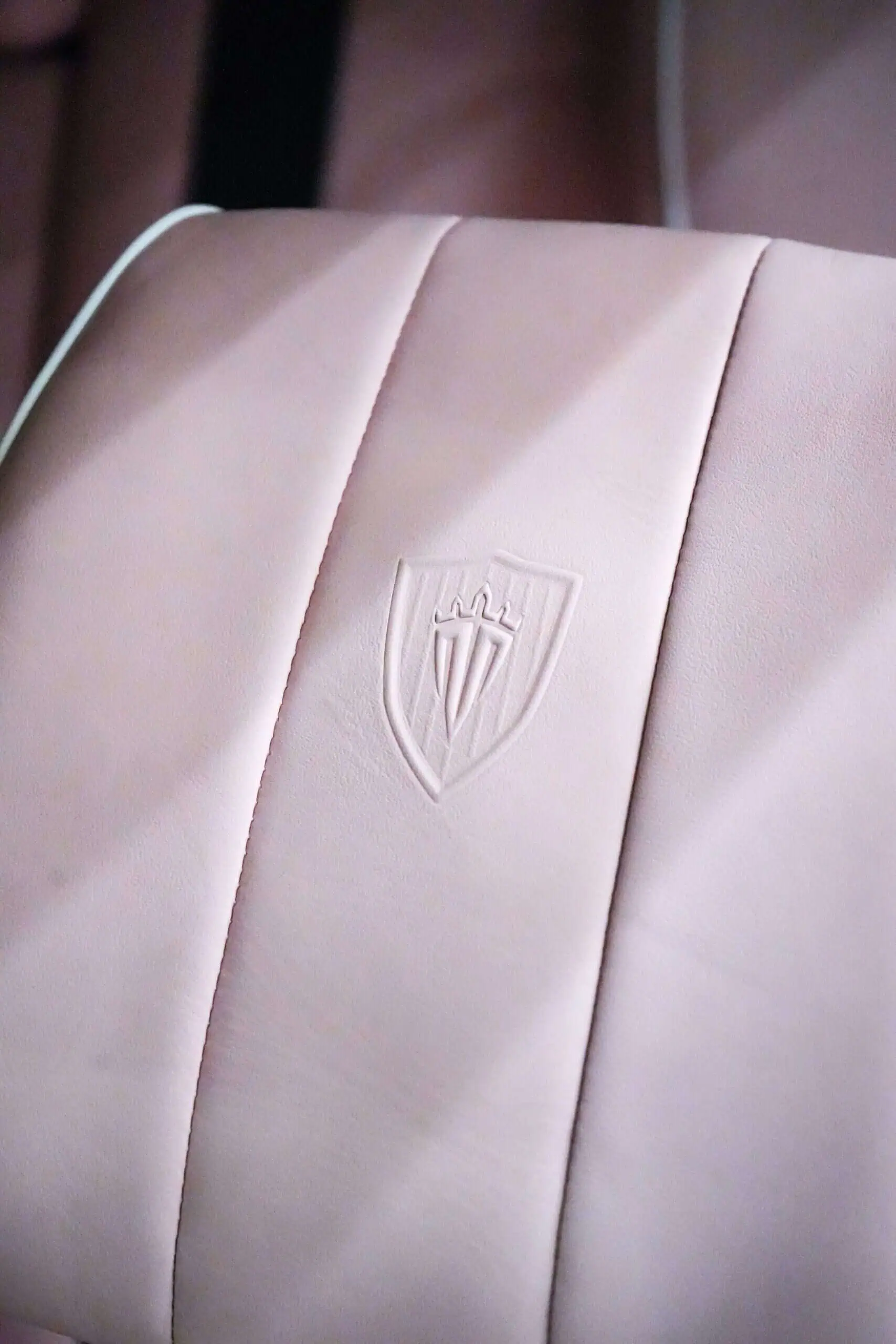 Luxurious vintage modern upholstered chair with subtle embossing, perfect for contemporary and retro-inspired interiors. Elegant design and high-quality craftsmanship for stylish living spaces.