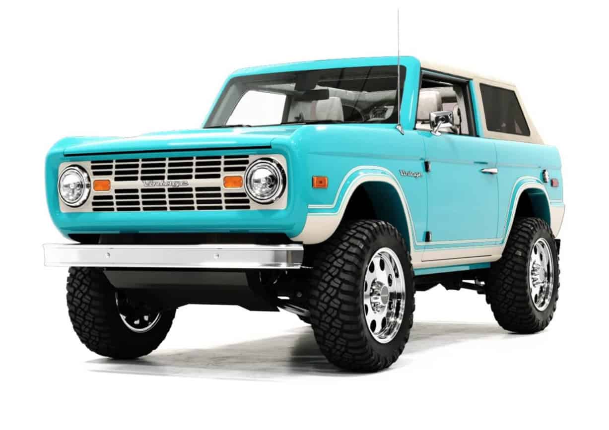 A classic vintage blue off-road SUV with retro design, large rugged tires, and modern accents, perfect for stylish outdoor adventures and vintage car enthusiasts.