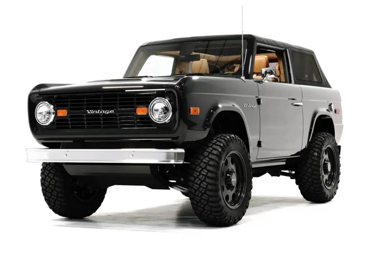 Vintage Modern Raven Black off-road SUV with rugged tires and classic design.