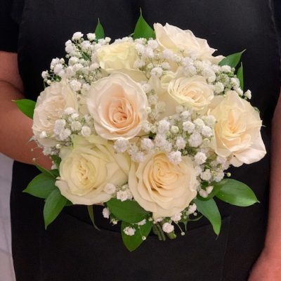 Elegant white rose bouquet with baby's breath and green foliage, perfect for special occasions or gifts in Las Vegas.