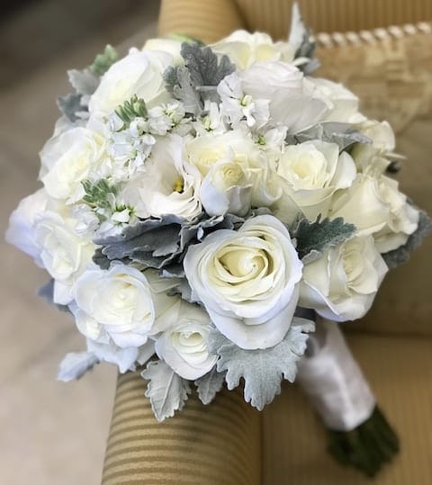 White Roses, White Lisianthus, White Stock and Dusty Miller.