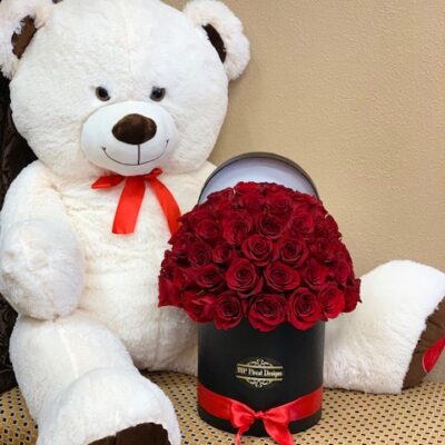 LARGE TEDDY BEAR AND RED ROSES