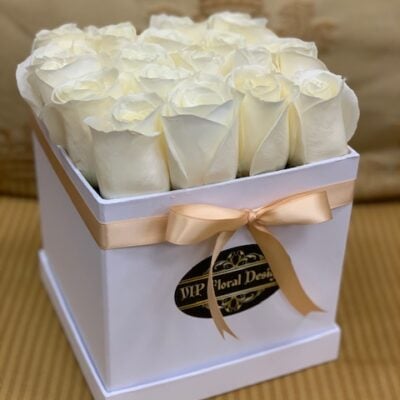 16 White roses in a square box with gold ribbon
