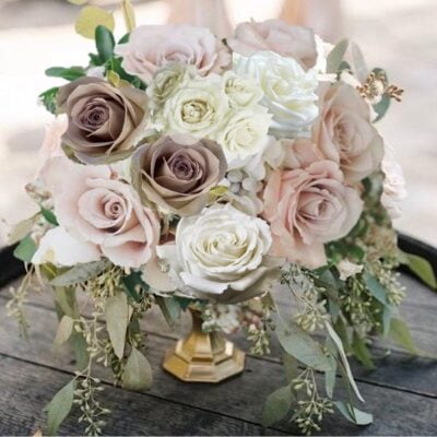 dusty roses and cream roses centerpiece
