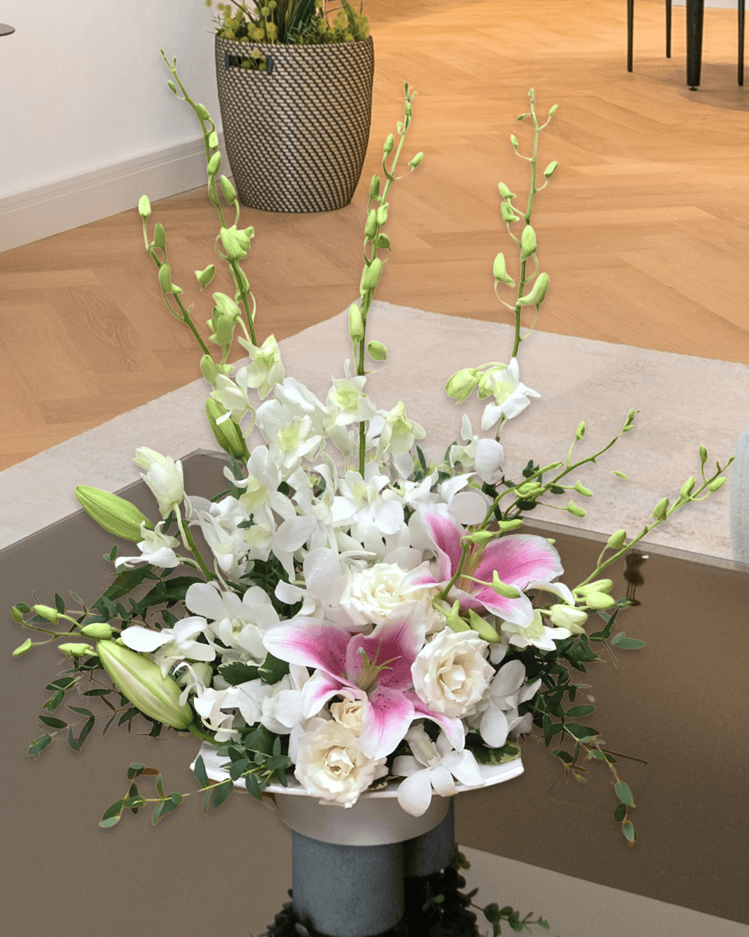 Discover our 'Orchid Whispered Wishes' bouquet with fragrant pink oriental lilies and exquisite orchids – a delicate, heartfelt gift for special moments.