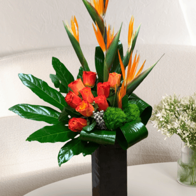 Las Vegas Flower Haven" is a desert oasis with a tropical twist. Featuring vibrant Birds of Paradise, orange roses, and elegant Monstera leaves, it's a lush escape in the heart of Las Vegas. Nature's beauty, redefined.