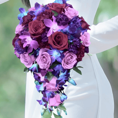 Blue Moon Lavender Cascade it is a bridal bouquet with lavender, purple and blue flower blooms for delivery in Las Vegas.