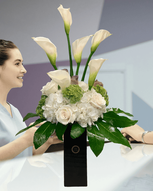Elegant white calla lilies and roses floral arrangement delivered by VIP Floral in Las Vegas, perfect for special occasions and celebrations.