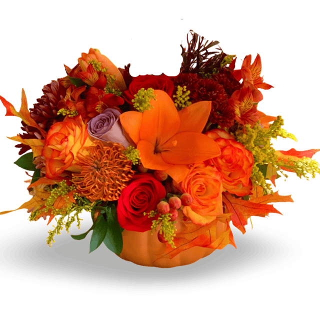 Vibrant autumn floral arrangement featuring roses, lilies, and seasonal blooms in warm orange, red, and purple tones, perfect for festive occasions and special celebrations.
