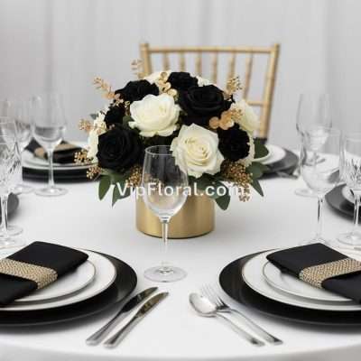 Elegant black and white floral centerpiece for sophisticated event decor, featuring roses and gold accents, perfect for upscale dinner parties, weddings, or special occasions in Las Vegas.