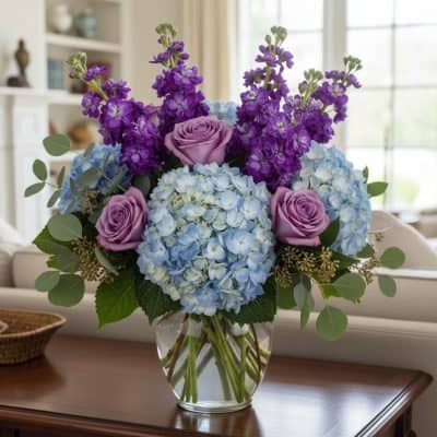 Vegas Elite purple blue flower arrangement with hydrangeas roses stock eucalyptus limonium Las Vegas florist delivery