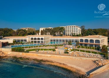 Beachfront hotel with golden sand and clear waters