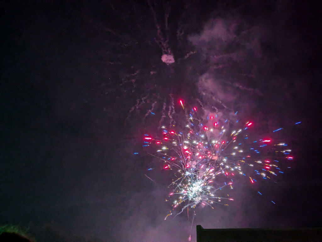 Fireworks over Ladonia at night, showcasing colorful explosions in the sky.