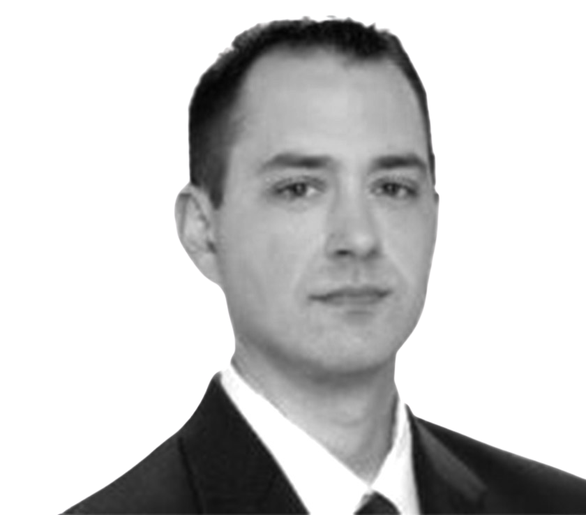 Formal business portrait of a man in a suit for About Us page.