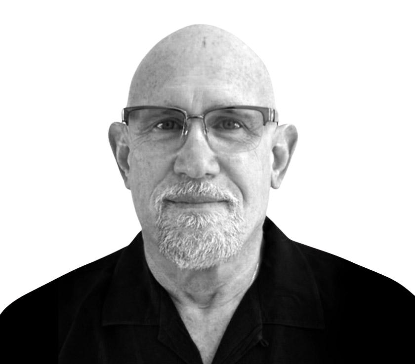 Black and white portrait of a senior man with glasses and a beard.