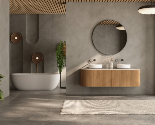 Contemporary bathroom featuring a bathtub, wooden vanity, round mirror, and minimalist decor.