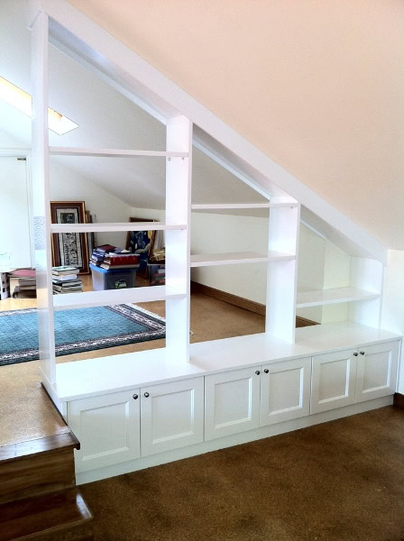 Custom white wardrobe with open shelving and storage drawers in Sydney.