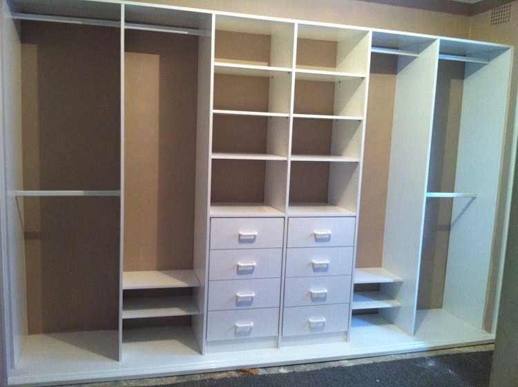 Custom wardrobe with shelves, drawers, and hanging space in Sydney.