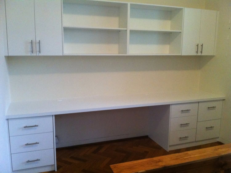 Wardrobe storage with white cabinetry and open shelving in Sydney.