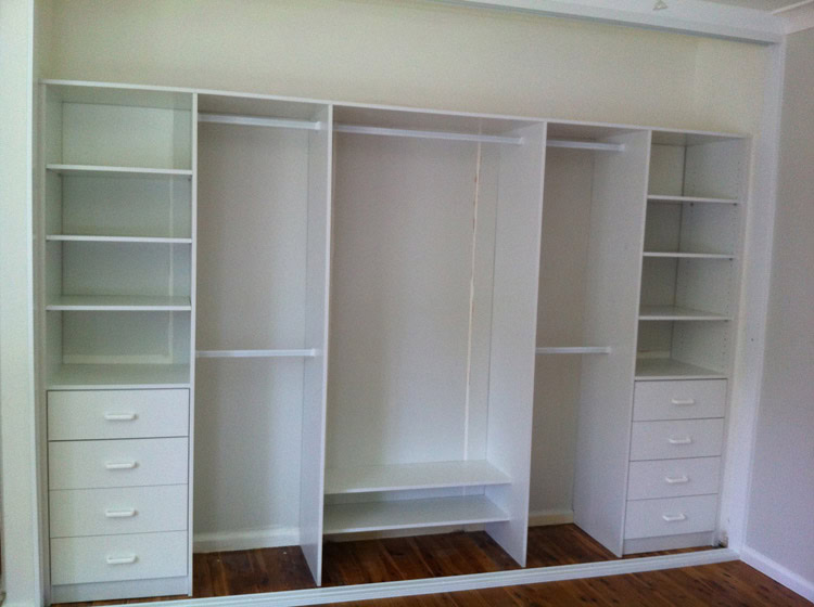 Custom built-in wardrobe with multiple shelves and drawers in Sydney.