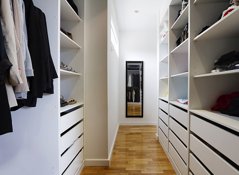 Walk-in wardrobe with custom shelving and drawers in Sydney, perfect for organised clothing storage.