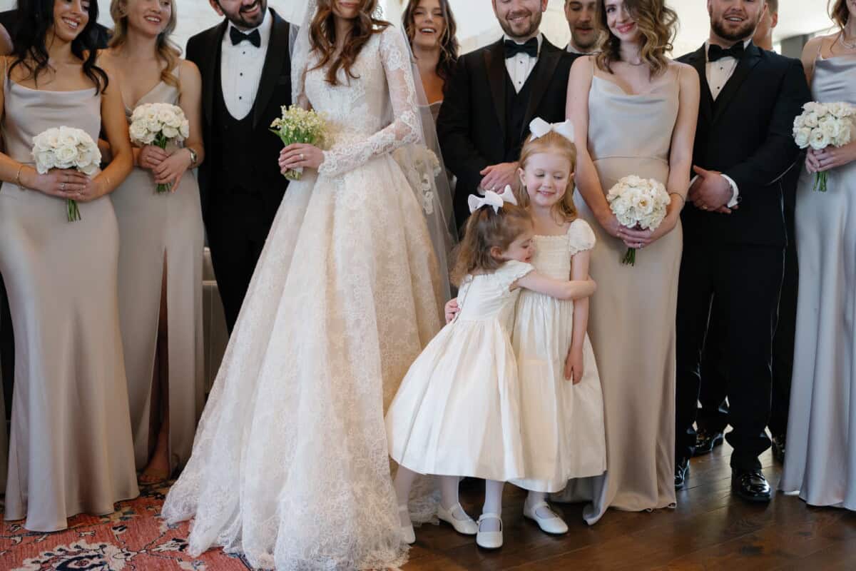 Elegant wedding planner with flowers and happy couples.