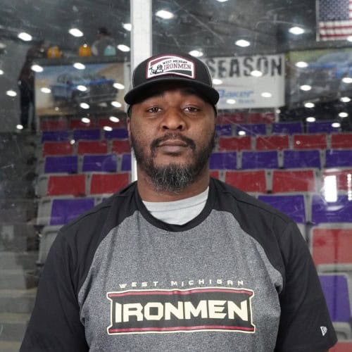 Damion Greggory, West Michigan Ironmen football player, in team apparel at the arena.