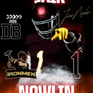 Jair Nowlin, football player for West Michigan Ironmen, in full gear, pointing forward with team bra.