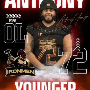 Anthony Younger, West Michigan Ironmen football player, smiling in team gear.
