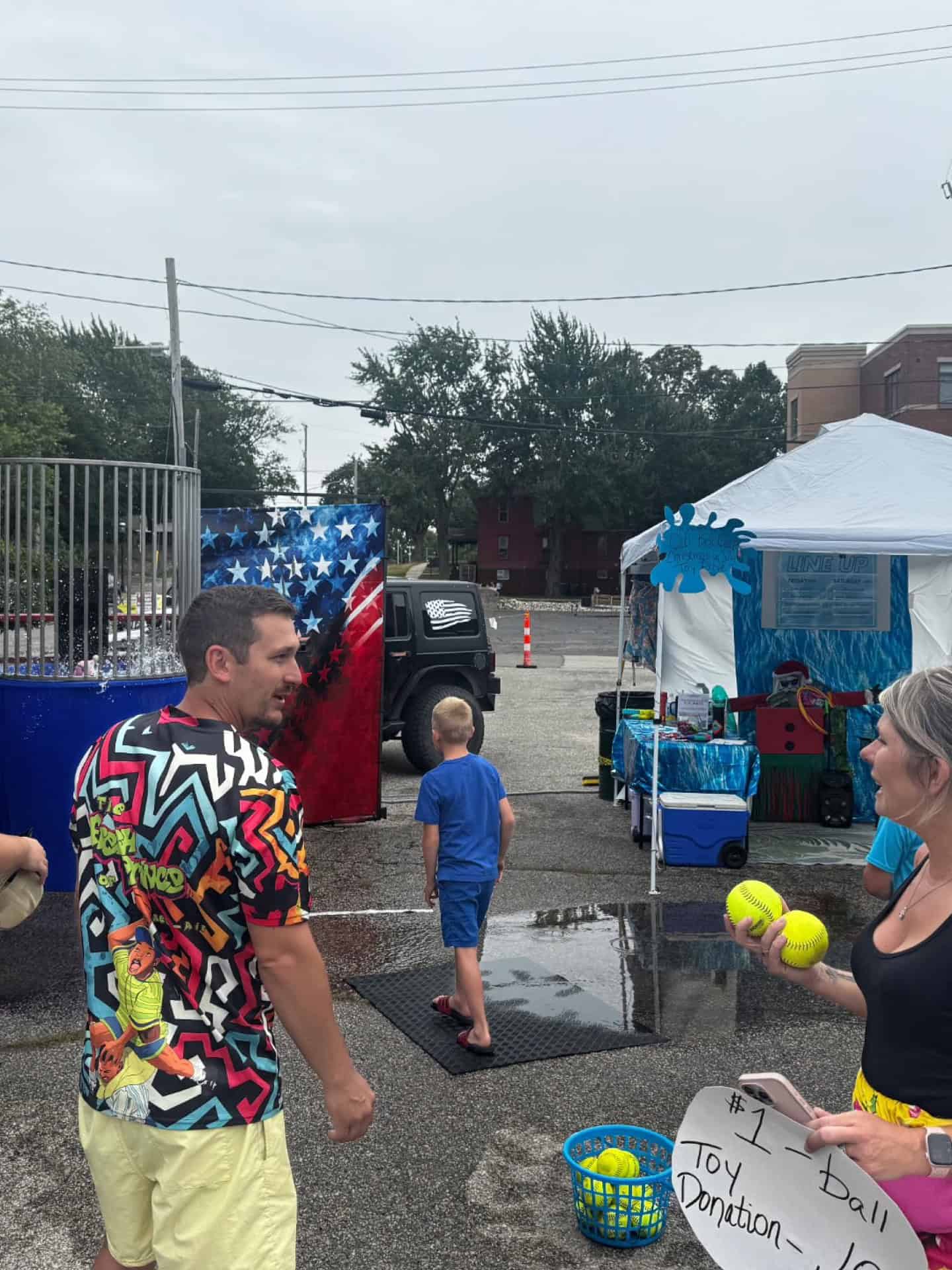 Fans enjoying a game day event with kids and activities in West Michigan.
