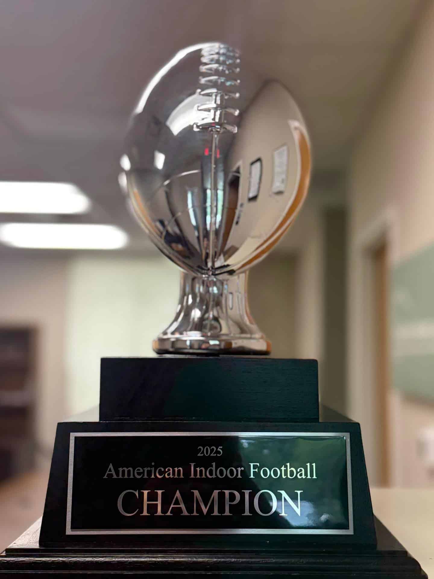 Silver football trophy for West Michigan Ironmen indoor football team.