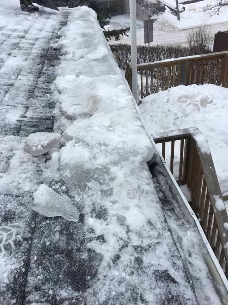 Mineral Rock Wool Insulating An Ice Damn on a Calgary roof in winter