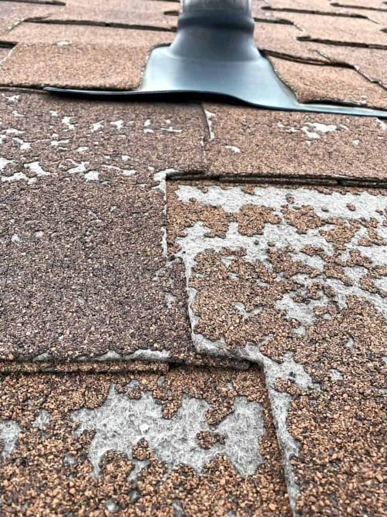An old roof that's lost shingle granules and needs to be replace.