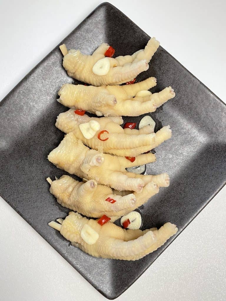 pickled chicken feet served