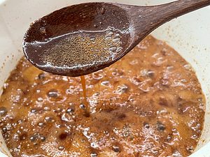 sauce is dripping from spoon