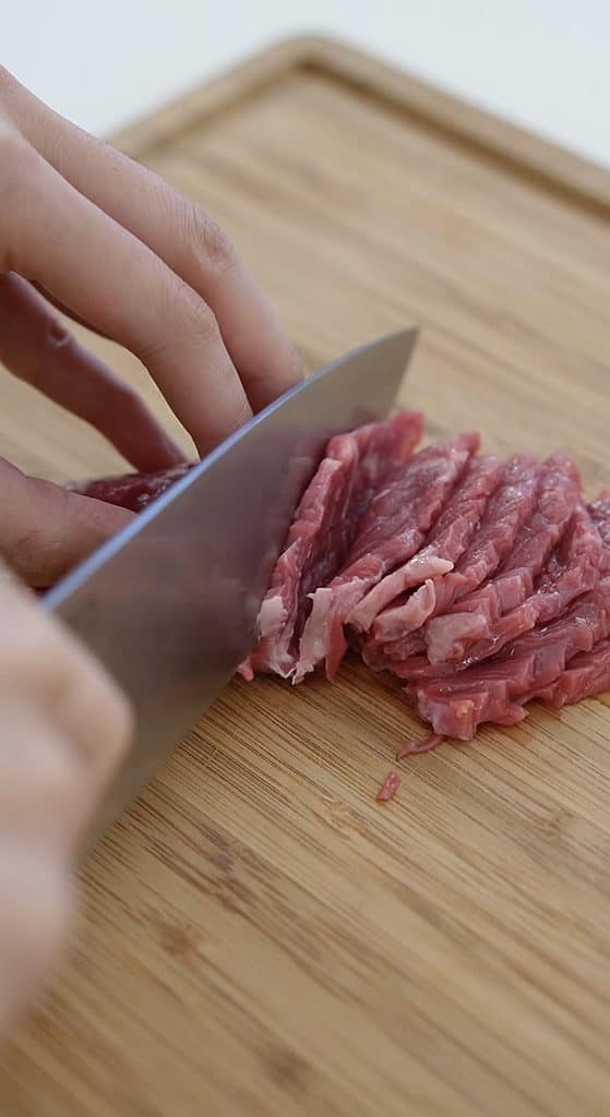 slicing the beef