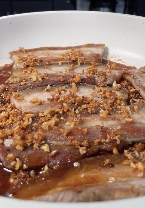 sprinkle fried garlic and shallot on top of pork belly