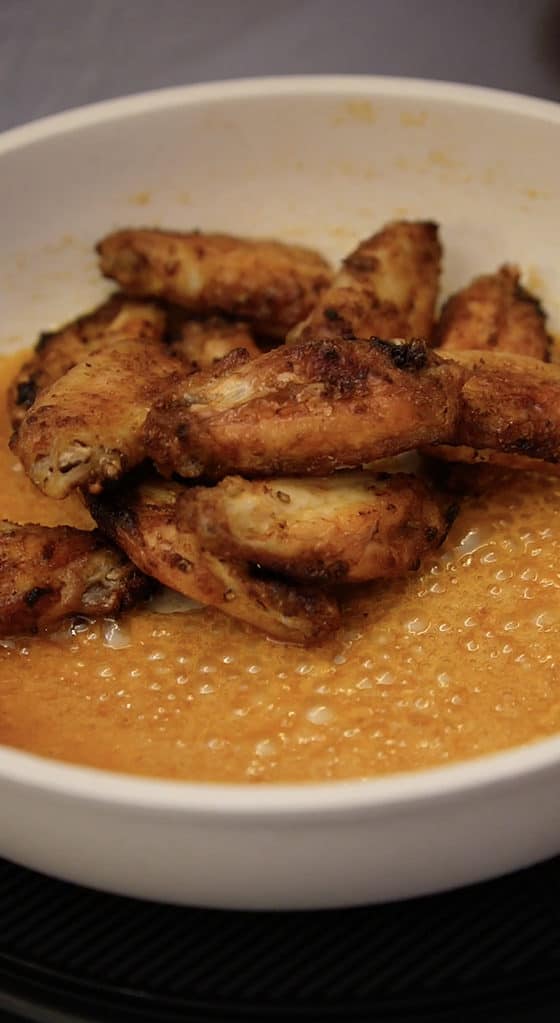 stir wings in the sauce
