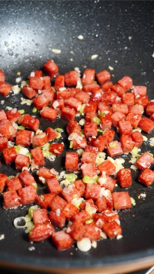 Saute spam with garlic and scallions