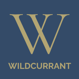 A large, gold letter W appears centered on a dark blue background. Below the letter, the word WILDCURRANT is written in uppercase gold letters. Wildcurrant Marketing