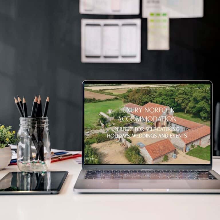 Luxury Norfolk accommodation on laptop screen, perfect for self-catering, holidays, weddings, events.