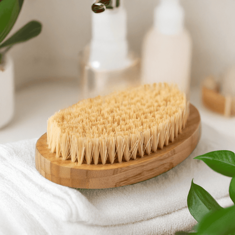 Eco-friendly teak bath brush on wooden soap dish, perfect for exfoliating skin.