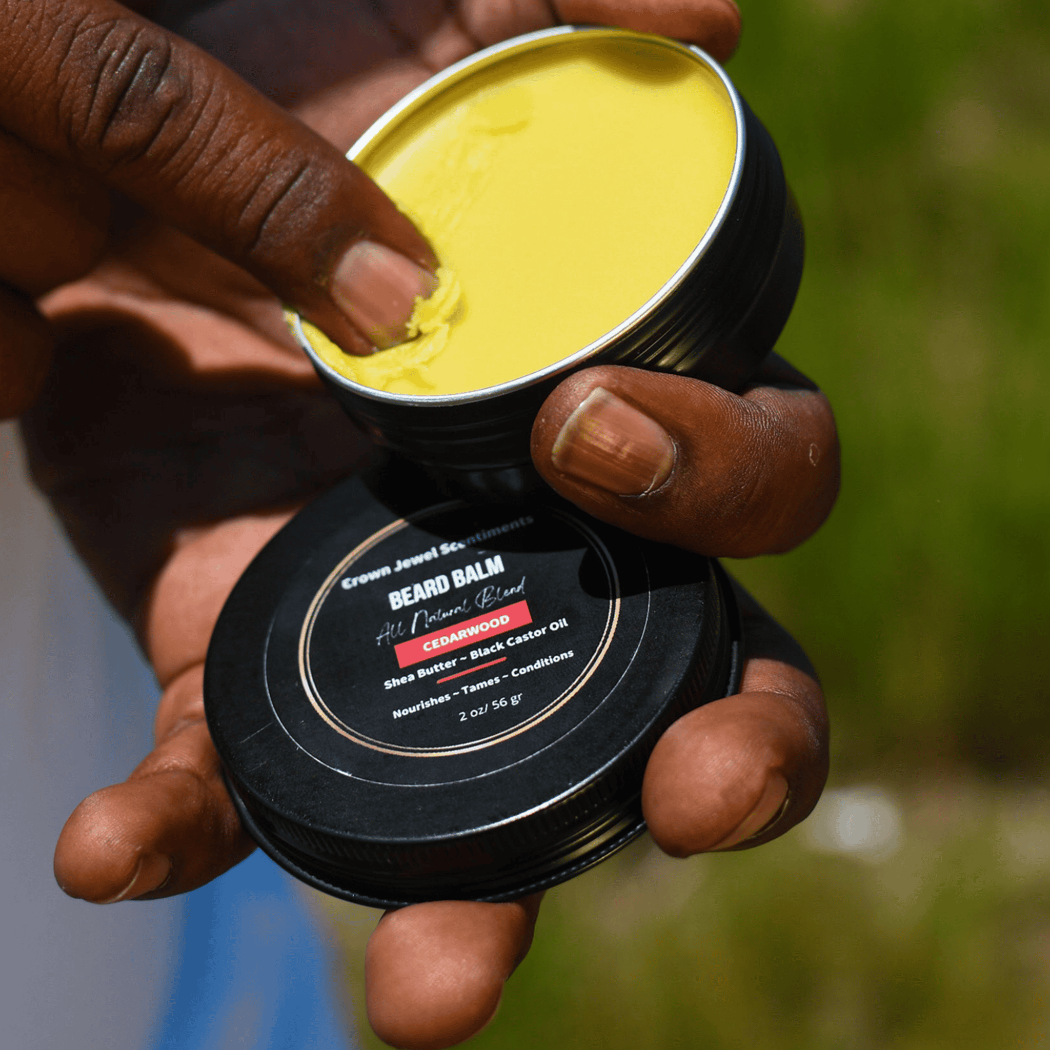 All-natural beard balm with cedarwood, shea butter, and black castor oil for nourishing, taming, and conditioning facial hair.