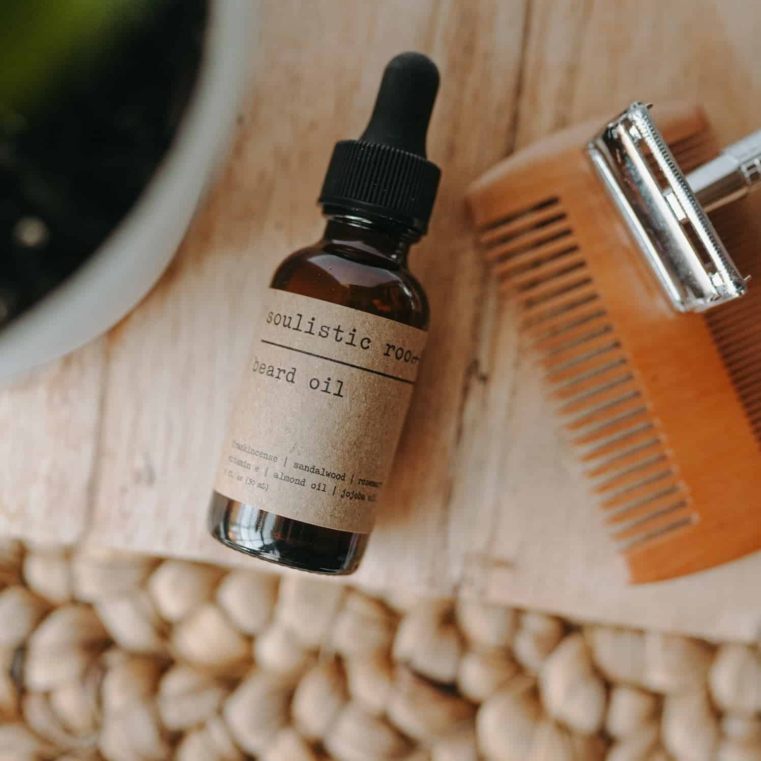 All-natural beard oil in a brown glass bottle with a dropper from Wildman Gear.