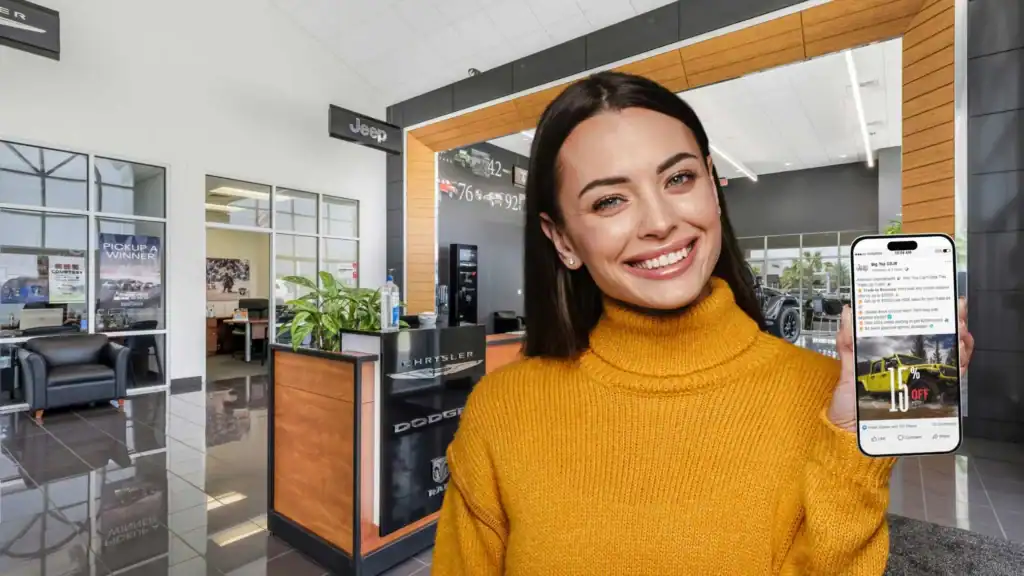 Young woman holding smartphone with auto dealership promotional content at Willowood Ventures Automotive Marketing, smiling inside showroom.