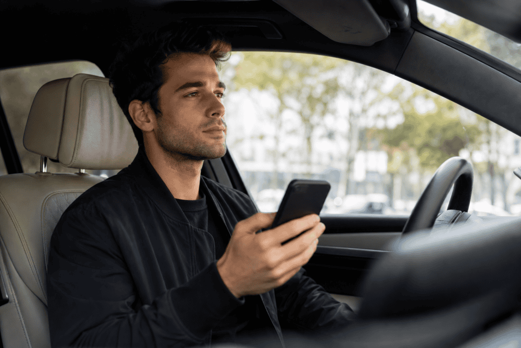 Car shopper using a smartphone inside a vehicle